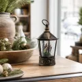 Новогодняя подсветка-фонарь XMAS WDL-24077B высотой 27,3 см • Пластиковый LED-ночник коричневого цвета с бронзовой отделкой, снегопад из блёсток, питание от USB или 3 батареек AA