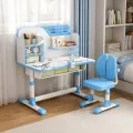 Парта со стулом PD-ST-04 синяя, 80×54 см, высота 65-71 см • детский учебный набор с лампой, полками надстройки, подставкой для книг и корректором осанки